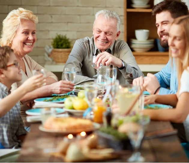 Midlife homeowners enjoying a family meal together
